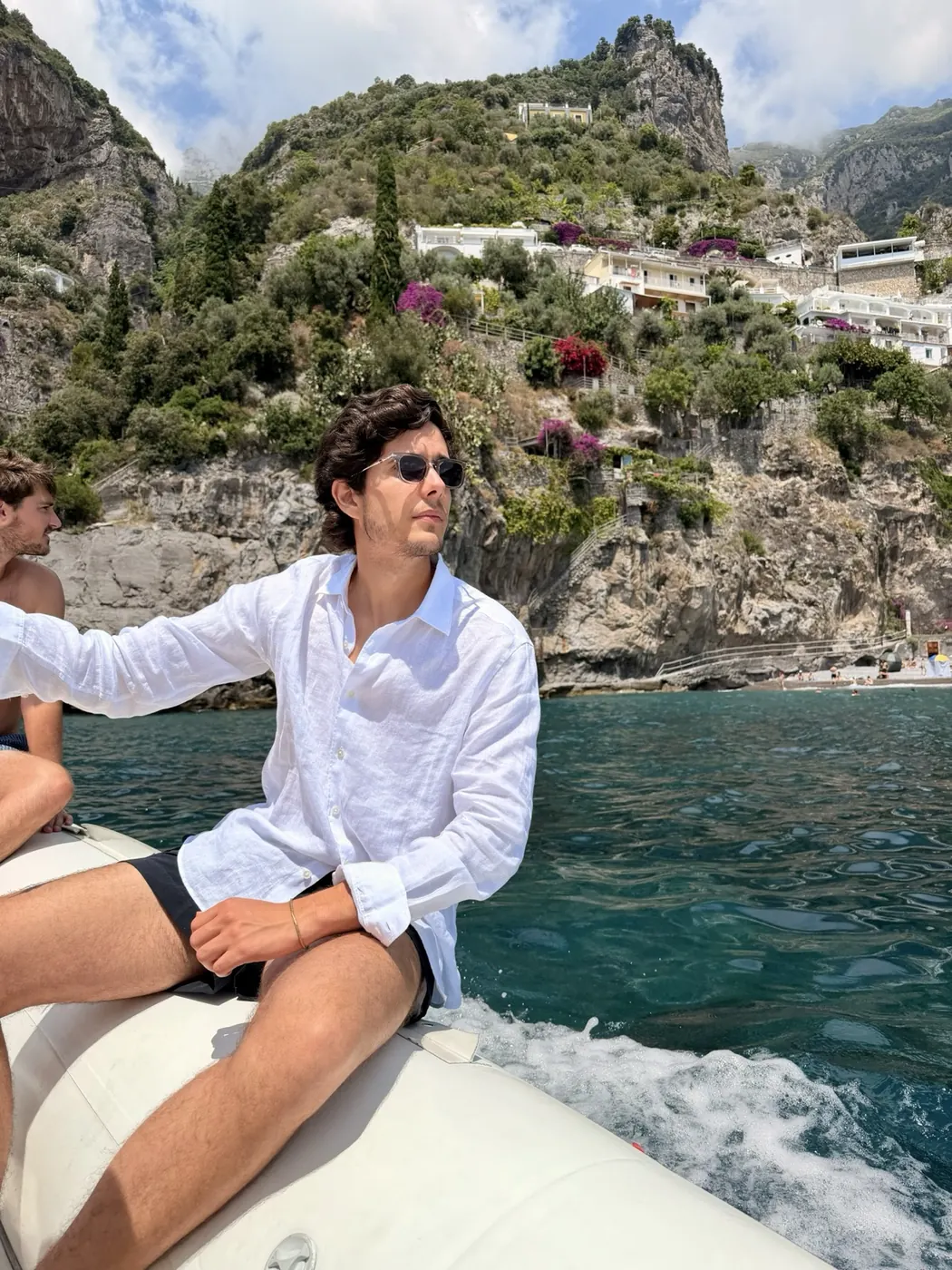 Alex Klaric on a private boat off the Amalfi Coast in Italy
